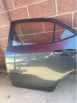 REAR DRIVER SIDE DOOR FOR 2014-2019 TOYOTA COROLLA (CHARCOAL) DARK GRAY COLOR.