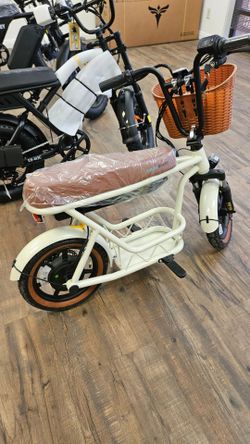 Electric scooter with seat and baskets
