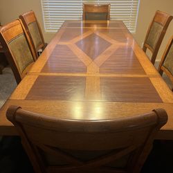 Counter height solid wood dining room table .