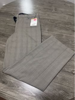 Brand New “Men’s” Gray/Plaid Dress Pants With The Original Tags Attached.