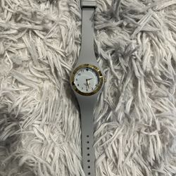 Kate Spade New York Rumsey watch with a gray silicone band and a gold-toned case