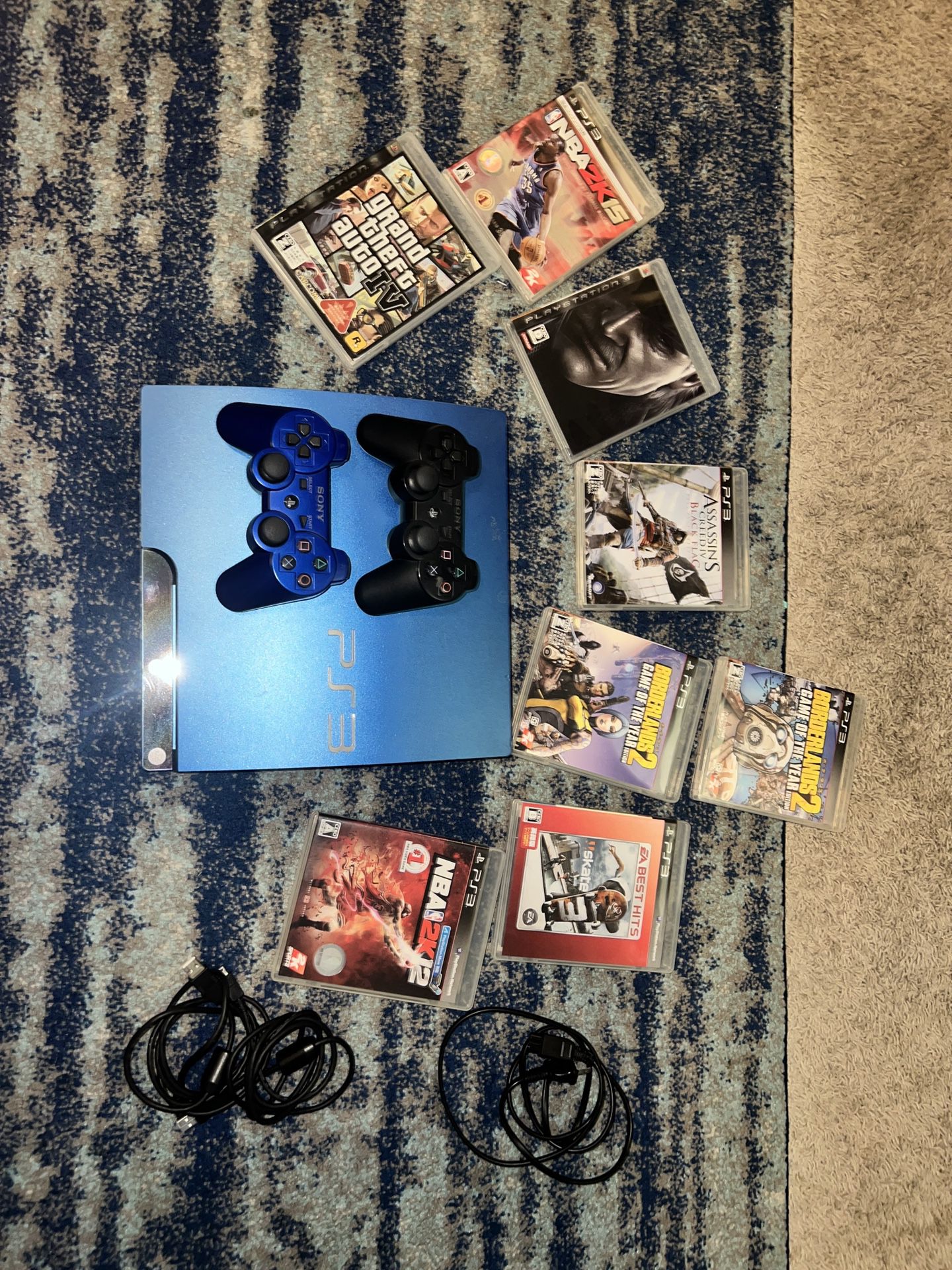 PS3 Blue with two controllers and 8 games