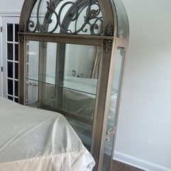 This is a Pulaski Curio Cabinet.  Like new.  Dimensions. 42 wide. 13 deep. 84 high. 