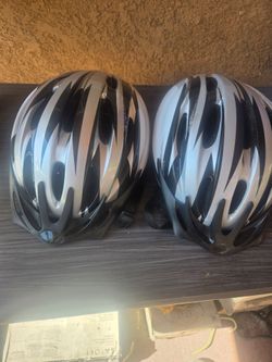 Two Bike Helmets Black and Silver