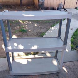 PLASTIC STORAGE RACK (CHECK PICTURES FOR SIZE) THANKS