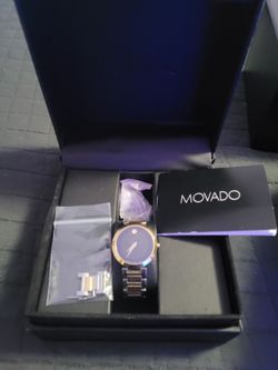 Movado woman's classic watch new in box with papers and links.