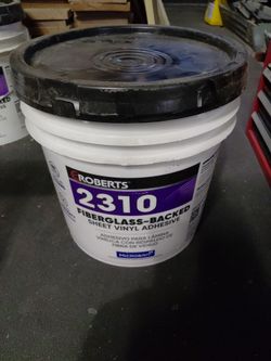 Fiberglass backed sheet vinyl adhesive