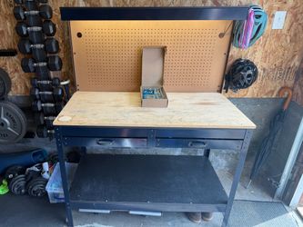Workbench with pegboard, light, outlets