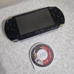 Psp 1000 with two movies plus charger