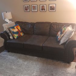 A  2 Piece Set Of Brown Leather Couch