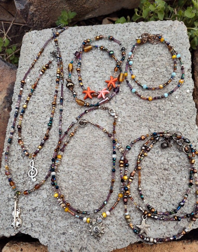 Glass Beaded Necklaces, an Assortment of Bracelets & Anklets