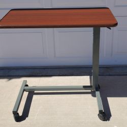 Adjustable Over bed Table / Mobile Desk
 Gently used and in great condition. This versatile rolling table is perfect for working from home, reading in