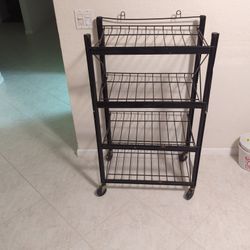 Metal Shelving 4 shelves on caster wheels