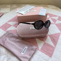 Miu Miu Black Oval Plastic Womens’s Sunglasses