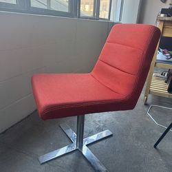 Red Ligne Roset swiveling  office chair