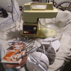 Oster Regency Kitchen Center, a vintage multi-appliance system. It includes a mixer, blender, food processor, and sometimes a grinder or juicer