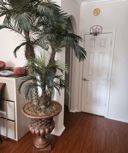 Potted fake palm tree