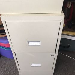 Tan Two drawer file cabinet 29 inches high 18 inches deep 15 inches wide