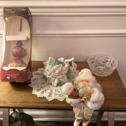 Includes a Holiday Time ornament, ceramic poinsettia teapot, sitting Santa,  doily, lead crystal bowl all in great condition!