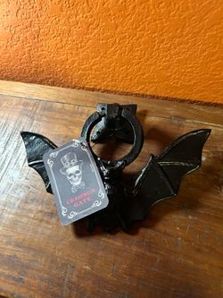 Crimson Gate branded heavy metal door knocker.