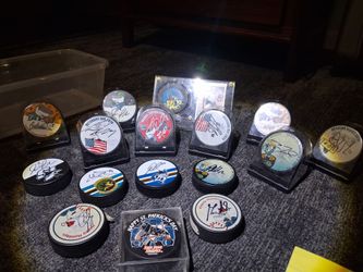 Lot of autographed san jose sharks pucks