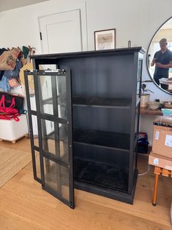 Black Cabinet with Sliding Glass Doors