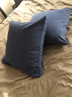 Two pillows with zippered removable covers