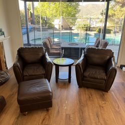Two Leather Armchairs and Ottoman