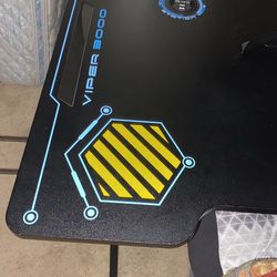 Gaming Desk Cup Holder And Two Headset Holders And Has Blue LED lights Around The Desk 