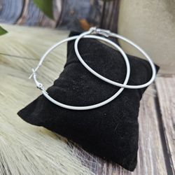 white retro 80's hippie hoop earrings approximately 2 1/4"