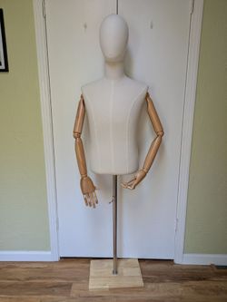 Male display dress form on flat wooden base