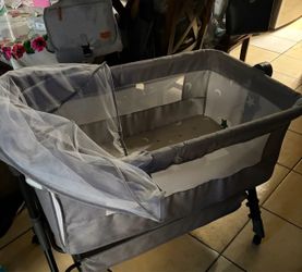 Gray Baby Bassinet with Canopy and Wheels