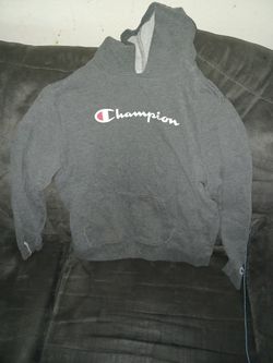 sweatshirt with a small hole in one of the sleeves