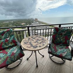 Beautiful Outdoor Swivel Rockers And Stone Top Table