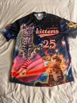 s Inland Empire 66ers "San Bernardino Kittens" jersey features a colorful space-themed graphic with cats on a baseball.