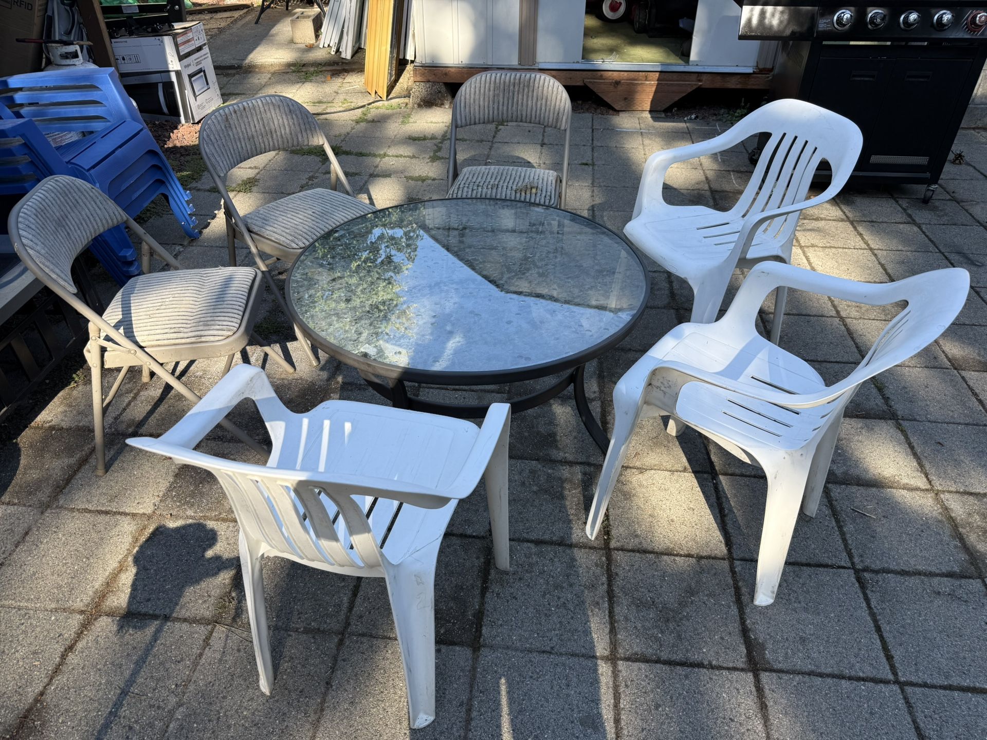 Small Table And Six Random Chairs