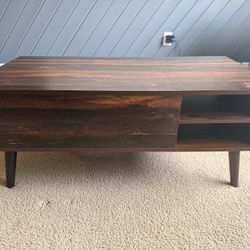 Coffee Table With Movable Top And Storage