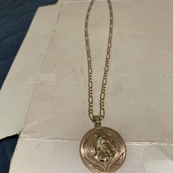 10k gold figaro chain with 14k double sided jesus pendant