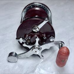 F88- Vintage Penn Squidder No. 140 Fishing Reel USA Made Maroon Bakelite Handles