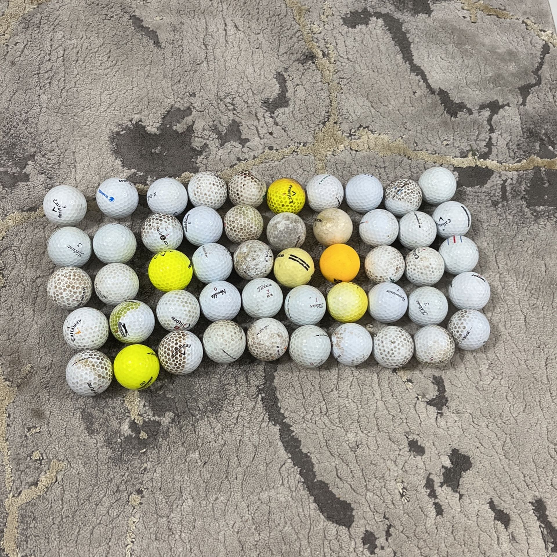 50 used golf balls