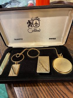 New never used Colibri gold tone pocket watch money clip key chain knife set