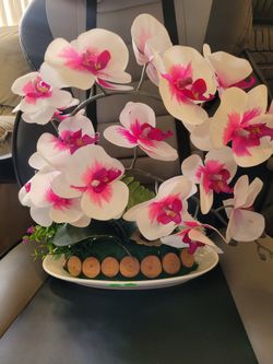 Artificial silk orchid with white ceramic vase