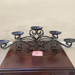 SEVERAL WROUGHT IRON CANDLE HOLDERS
