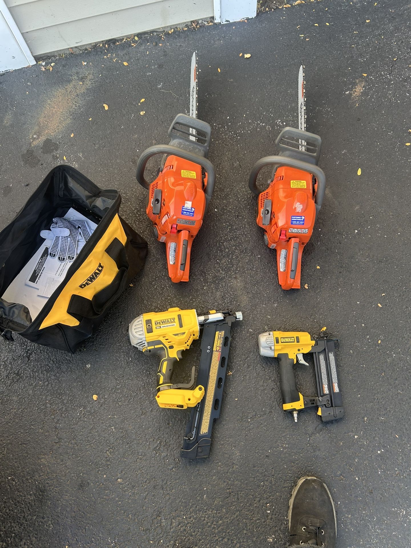 Two Husqvarna chainsaws and Wonderwall battery operated nail gun and air gun