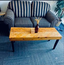 Reclaimed coffee table with chevron pattern.