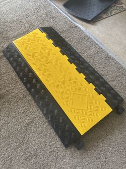 Speed bump/cable protector