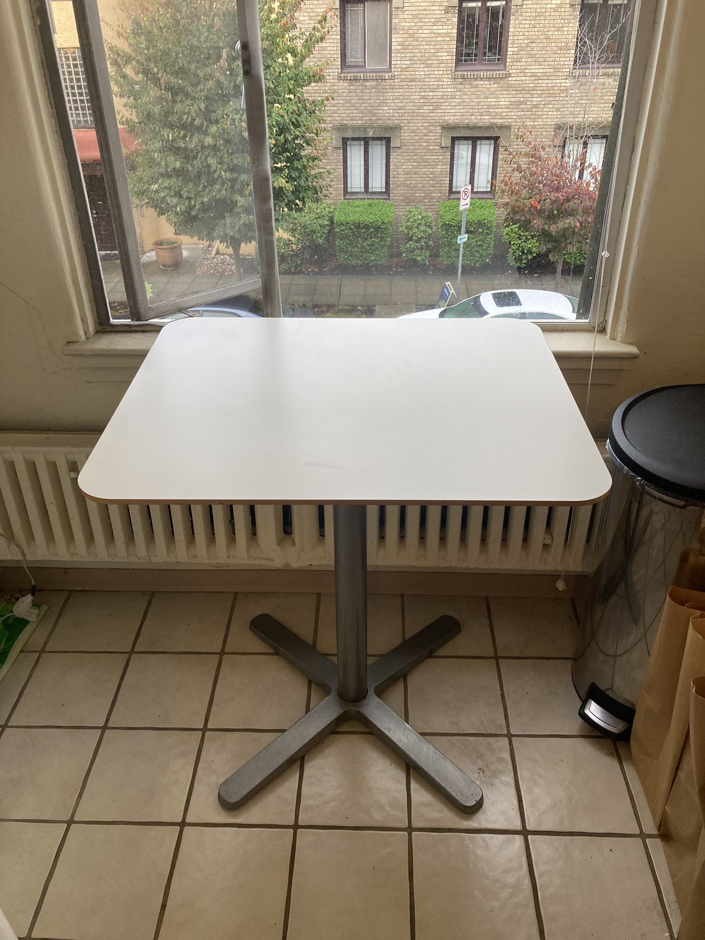 Small, white, modern kitchen table
