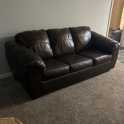A Chocolate Leather Couch With Pullout Bed