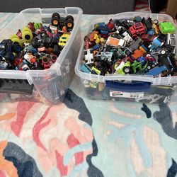 2 15quart bins full of hot wheels and car toys toys