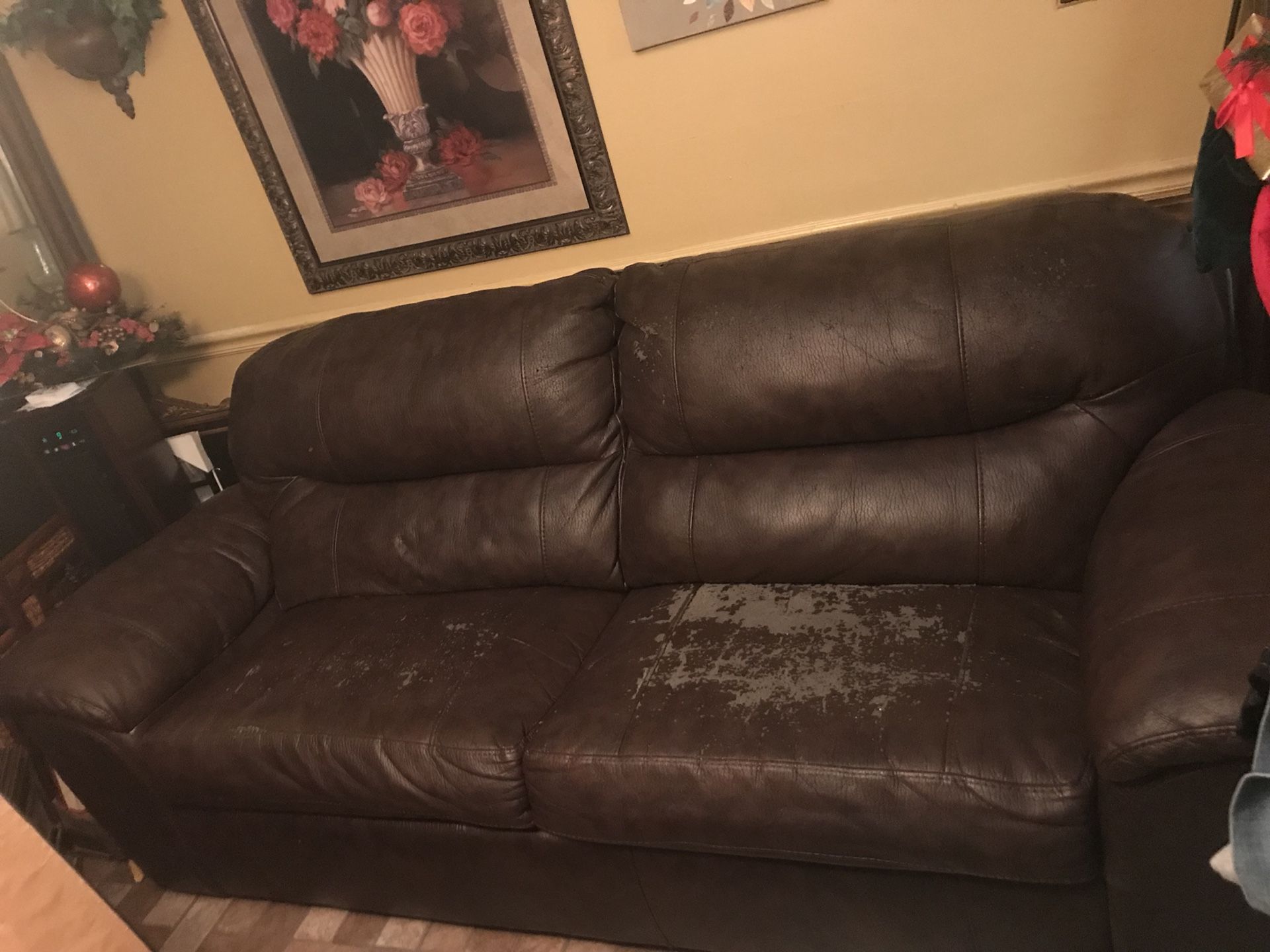 Large brown couch with built in bed